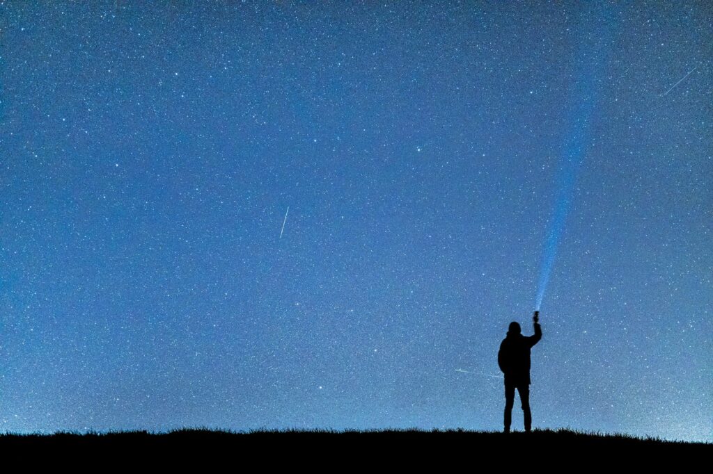 silhouette of man under blue sky during nighttime